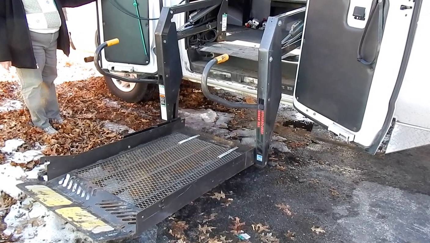 A wheelchair lift on the side of a van
