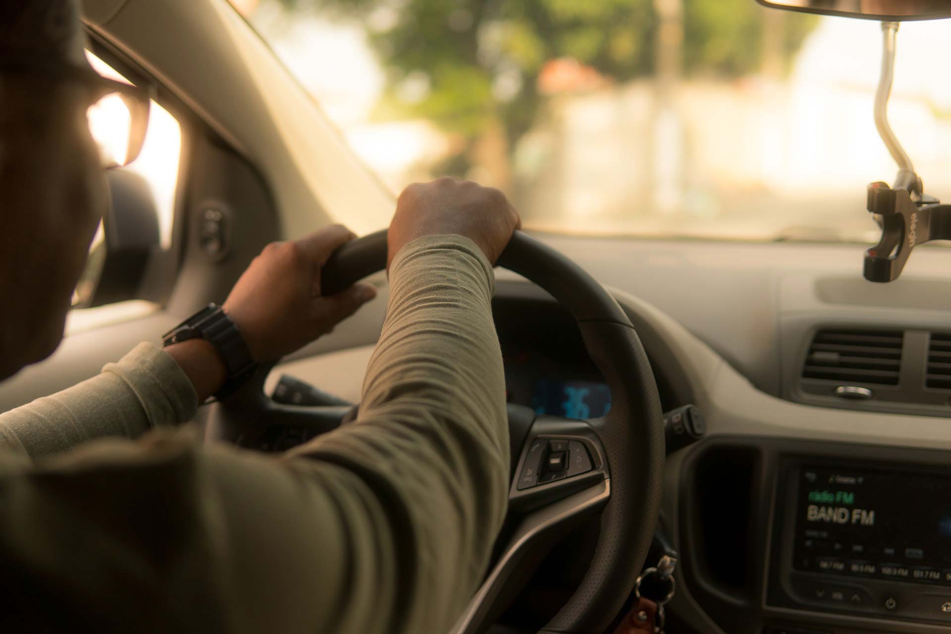 Over-the-shoulder shot of a taxi driver